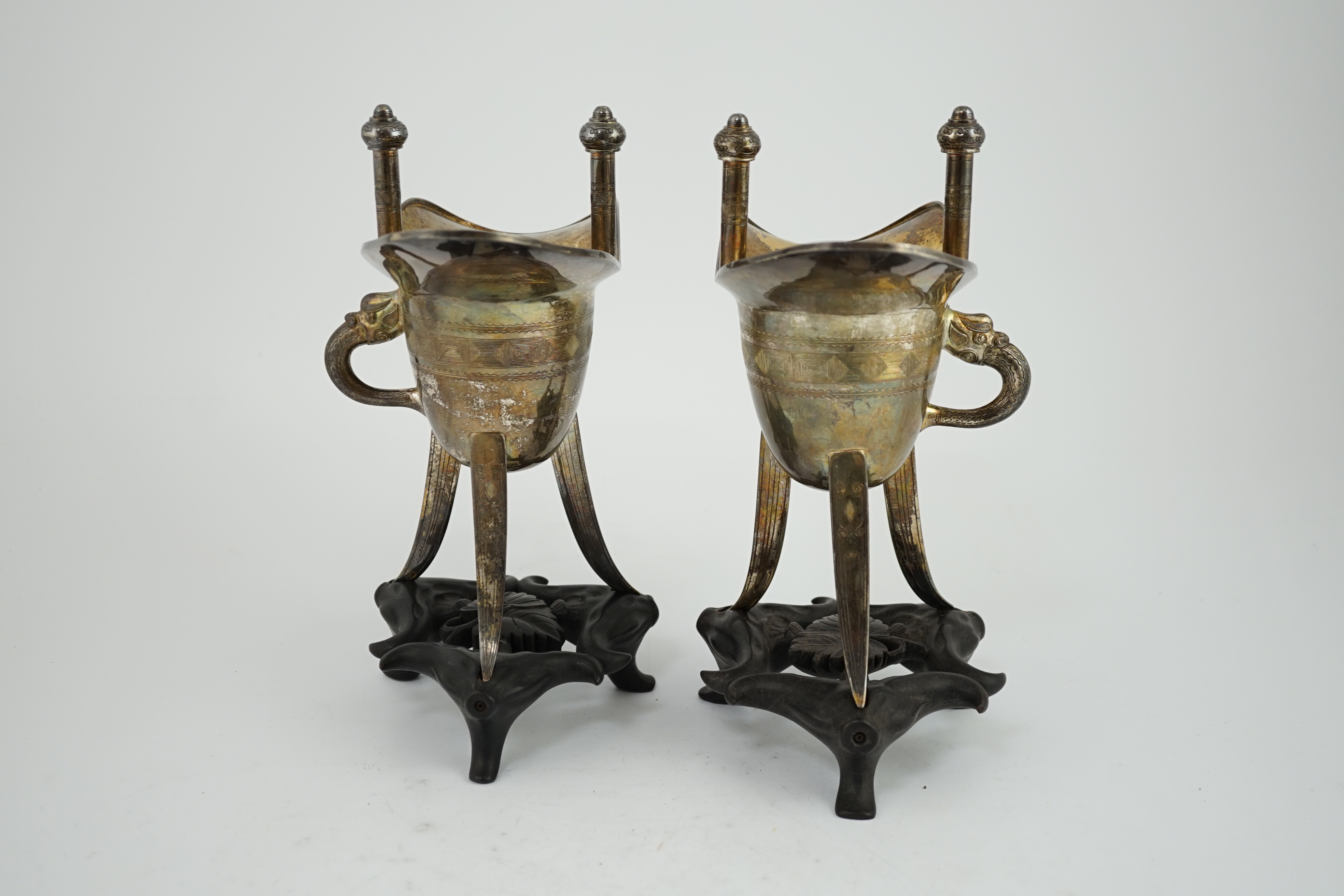 A pair of early 20th century Chinese archaistic silver 'Jue' wine cups, by Wang Hing, Hong Kong